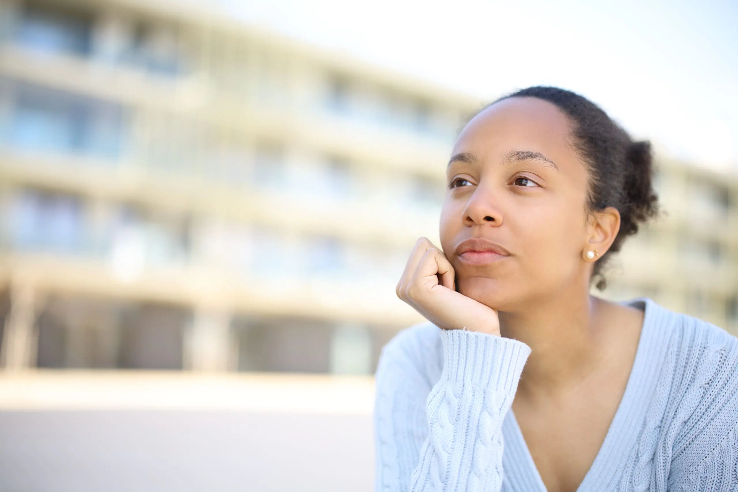 Black Woman Thinking Looking Away In The Street
