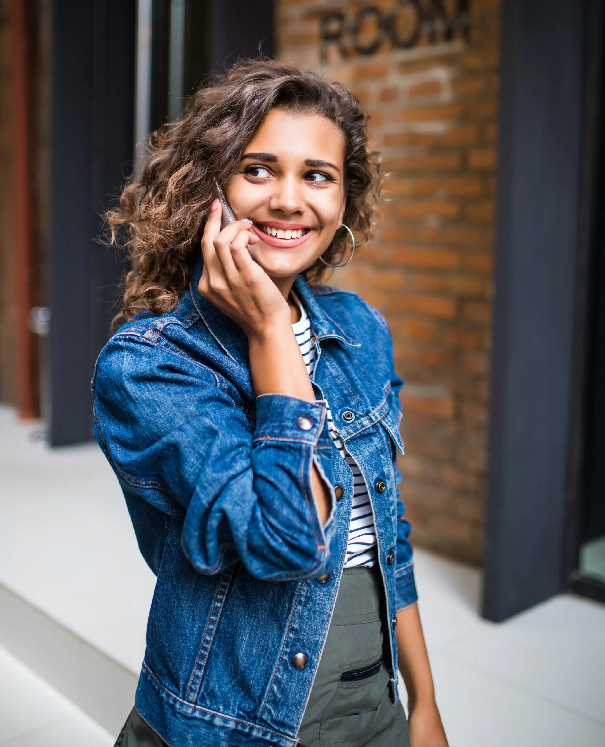 bigstock-Young-Attractive-Latin-Curly-W-266697613