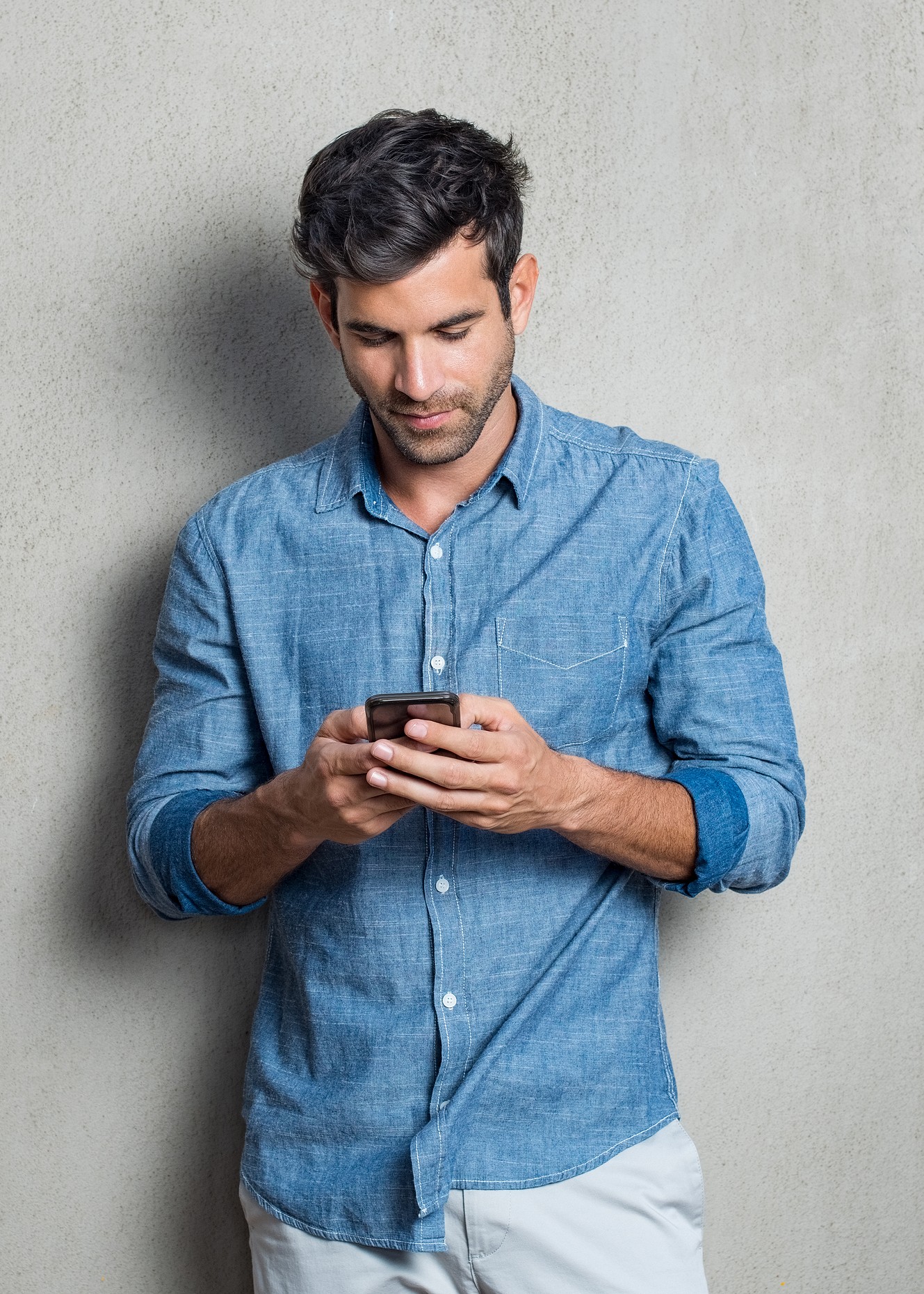 bigstock-Young-man-writing-phone-messag-206291725 (1)